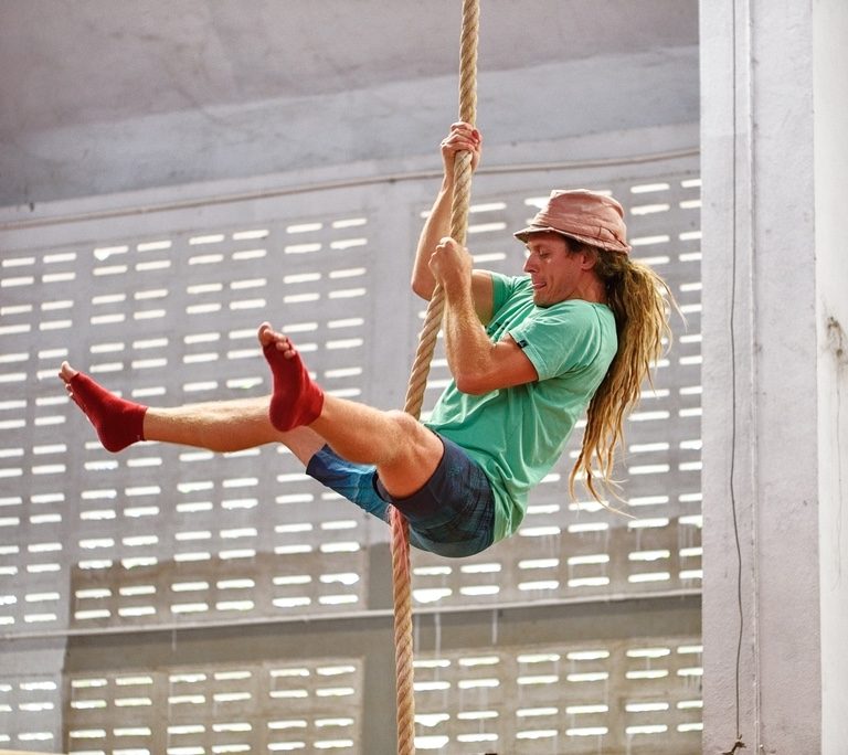 Sam Salwei climbing a rope