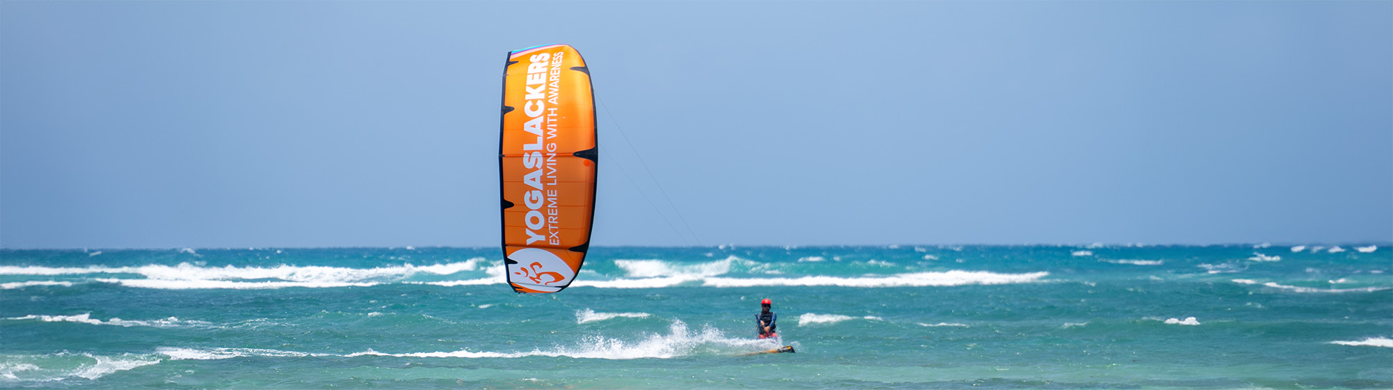 YogaSlackers Co-Founder Sam Salwei showcasing his custom Ozone Edge 11m kite!